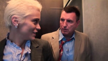 German blonde MILF with big tits and short hair does anal in an elevator