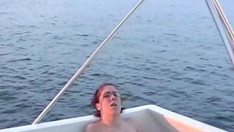 Three horny amateur lesbians eat each others pussies and masturbate while on a boat trip